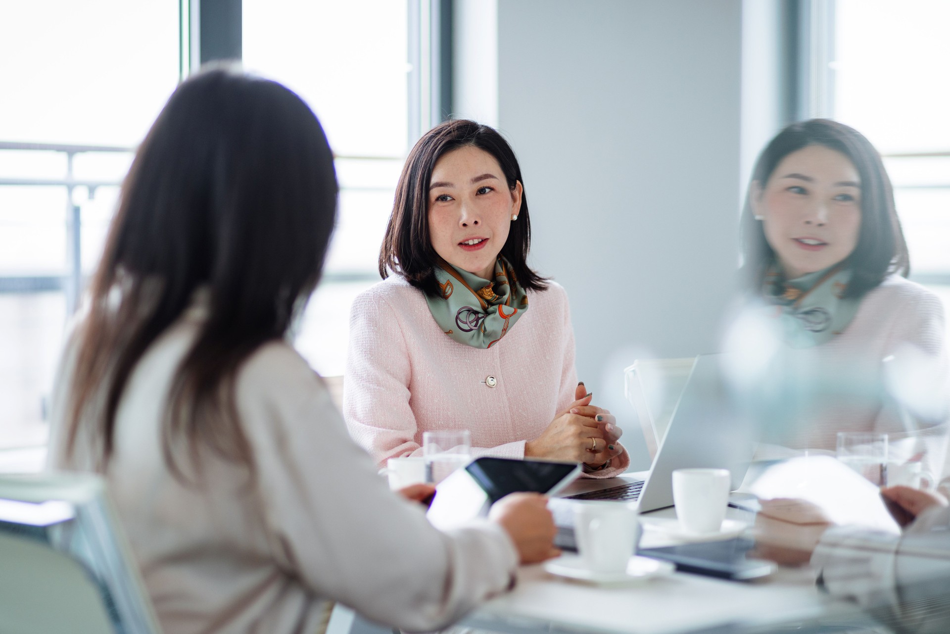 Asian Businesswomen Collaborating in Modern Office